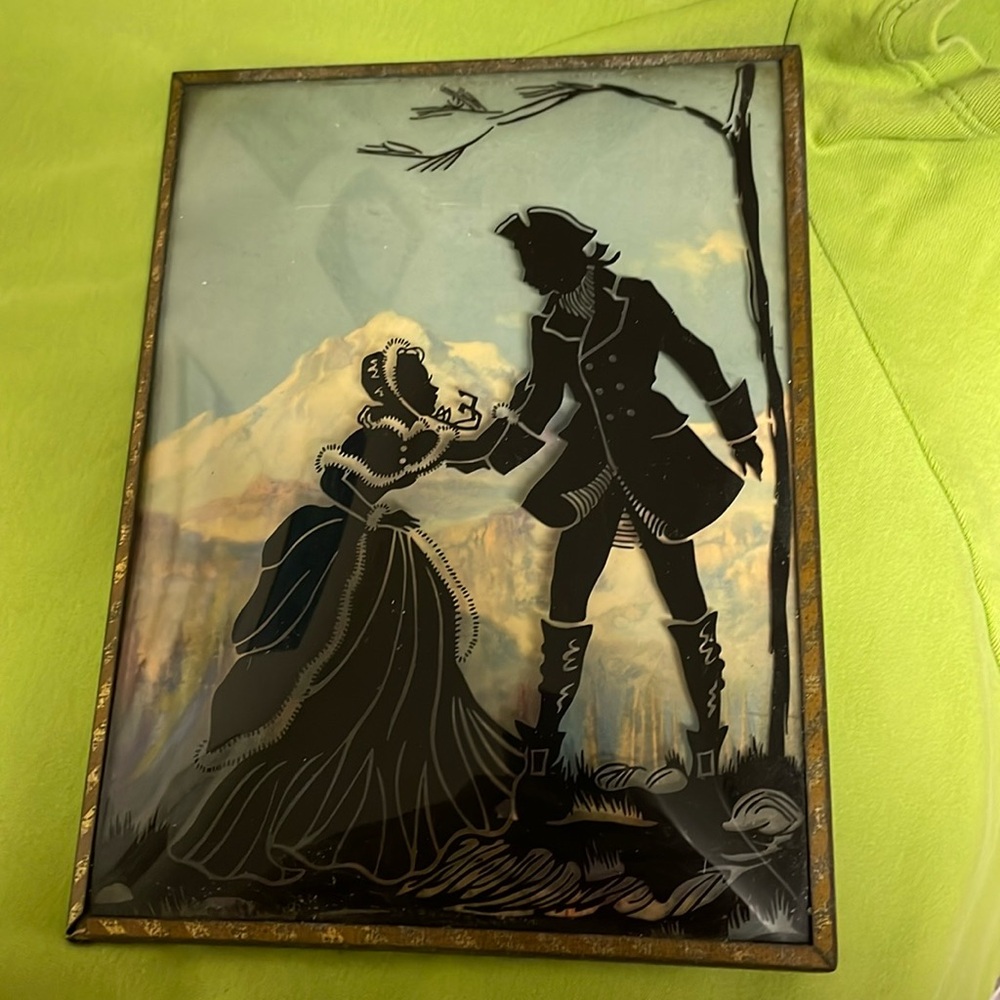 Vintage bubble silhouette picture. Man and woman on glass with mountains painted